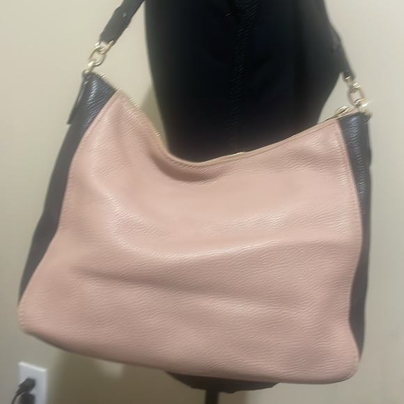 Pre-loved Kate Spade shoulder bag. Colors are fawn and black with gold accents. - Picture 4 of 9